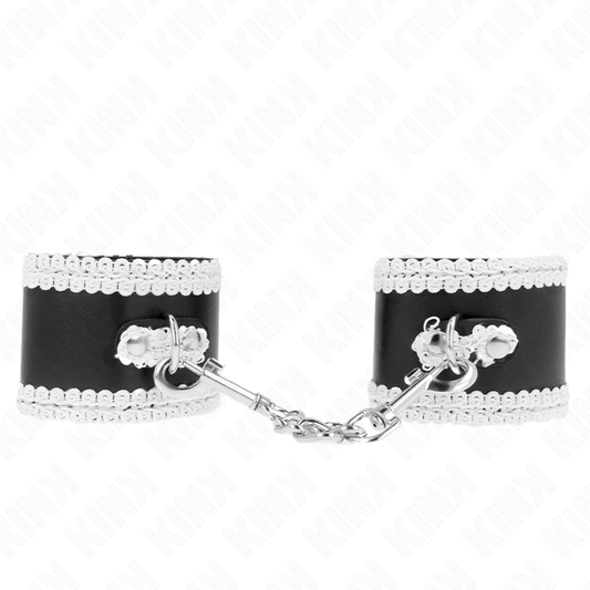 KINK - SCHWARZE HANDGELENKFESSELN MIT WEISSER VERZIERTER SPITZE, VERSTELLBAR 20-23 CM X 5,5 CM